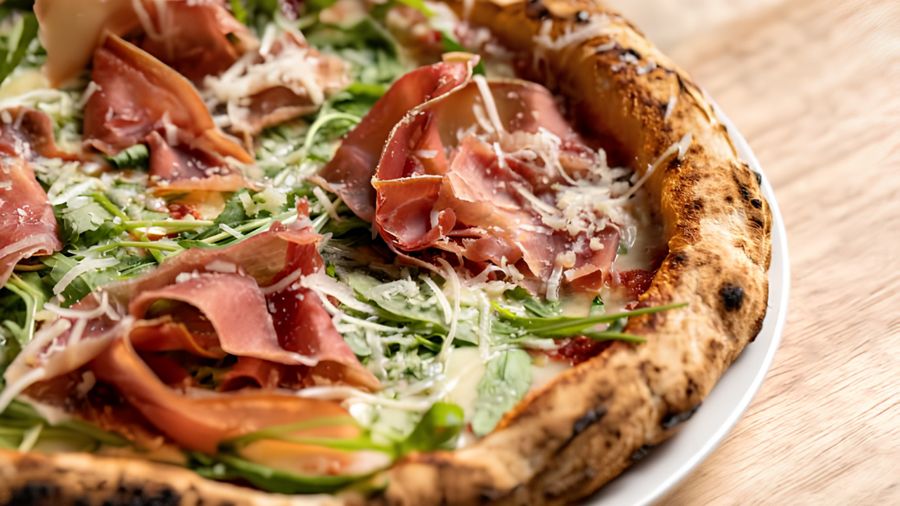 Artisanal mortadella and pistachio pizza with stracciatella and basil from SEO Basilico in Winter Garden