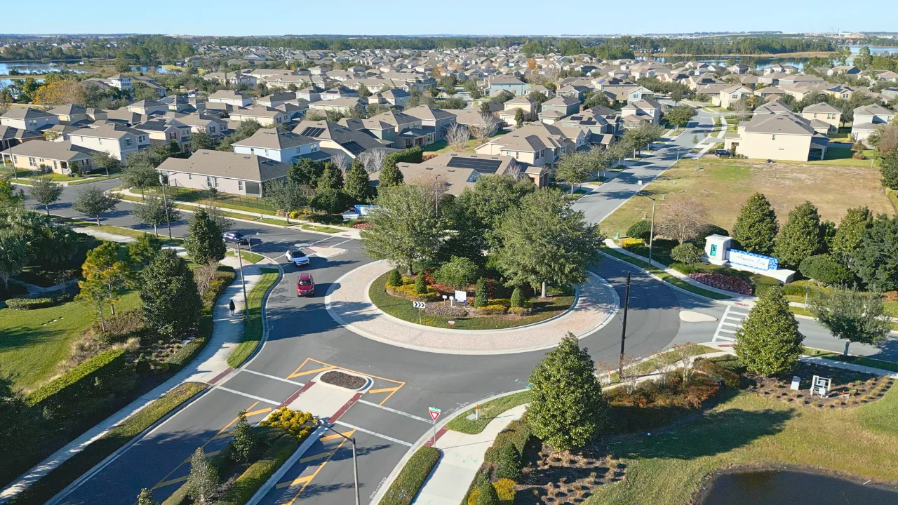 Aerial view of a Horizon West neighborhood roundabout with homes, lakes and trees in Winter Garden, Florida