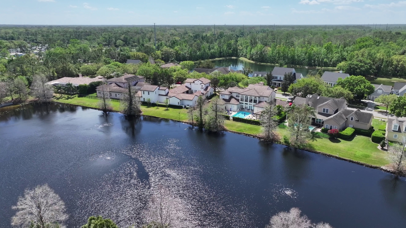 Lakefront homes and a fountain pond in Celebration, Osceola County, Florida