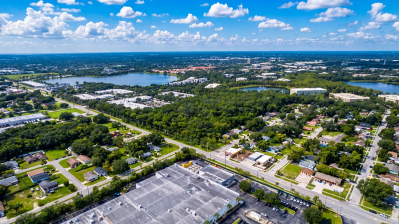 Aerial view of the Orlando area with neighborhoods, commercial buildings and lakes stretching to the horizon